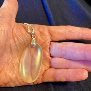 Beautiful angel aura pendant on sparkling chain.